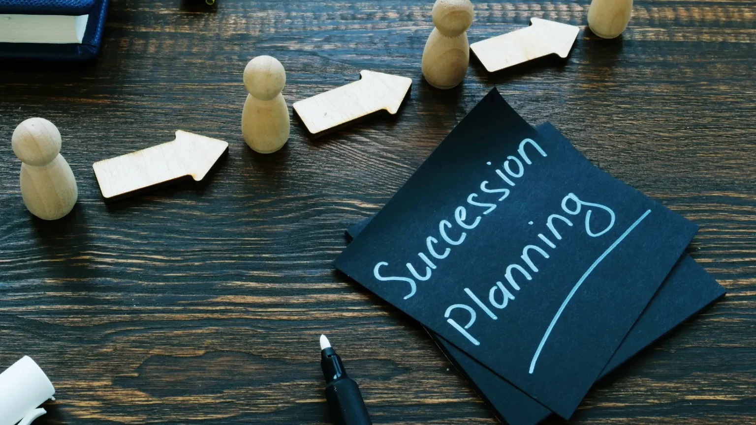 Business Succession Between Partners: Questions to Resolve Before an Exit Two business partners reviewing ownership, exit and succession decisions
